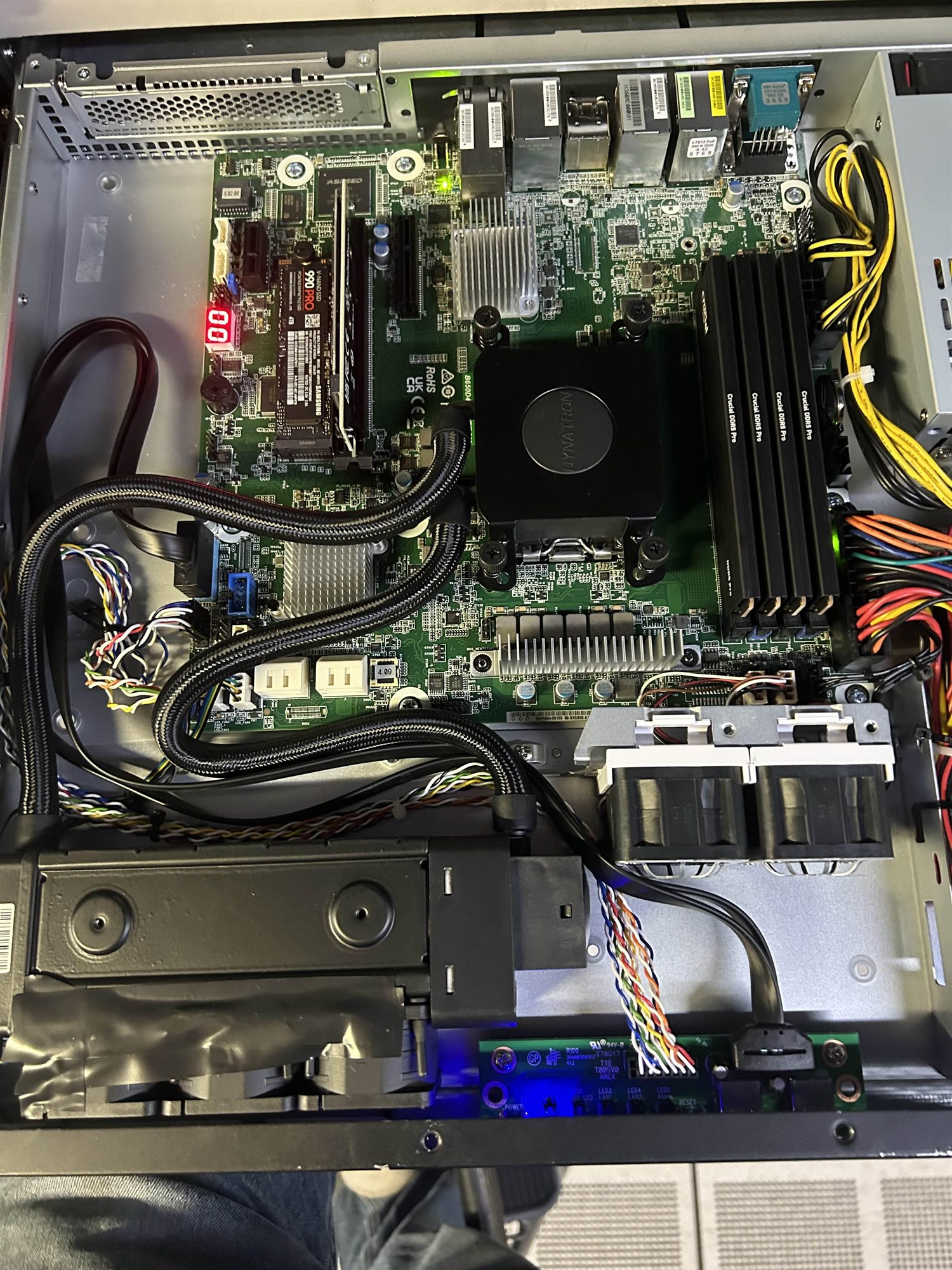 Inside an open server chassis: motherboard, memory, cooling and storage.